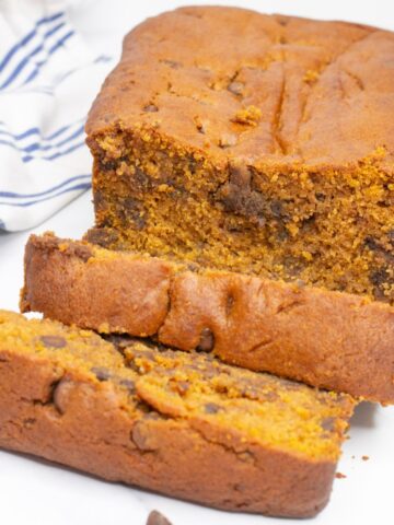 Pumpkin Chocolate Chip bread cut on a cutting board.