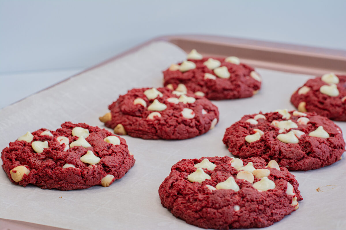 Red velvet cookies on a sheet pan.