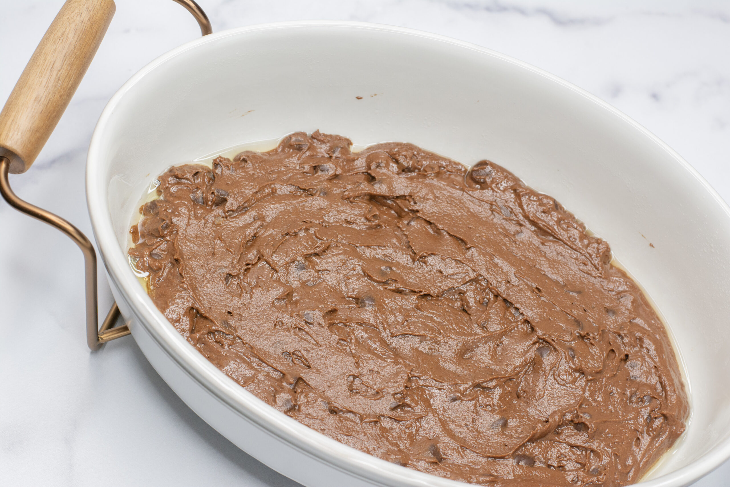 Cake batter in a dish.
