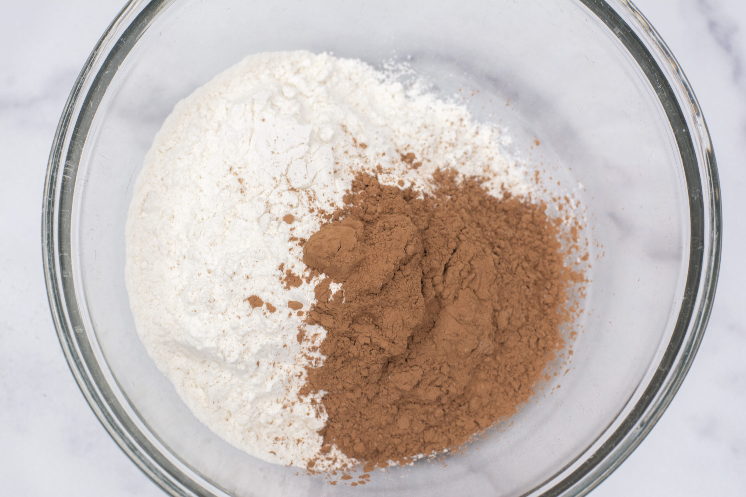 Bowl of flour, cocoa powder, baking soda and salt.