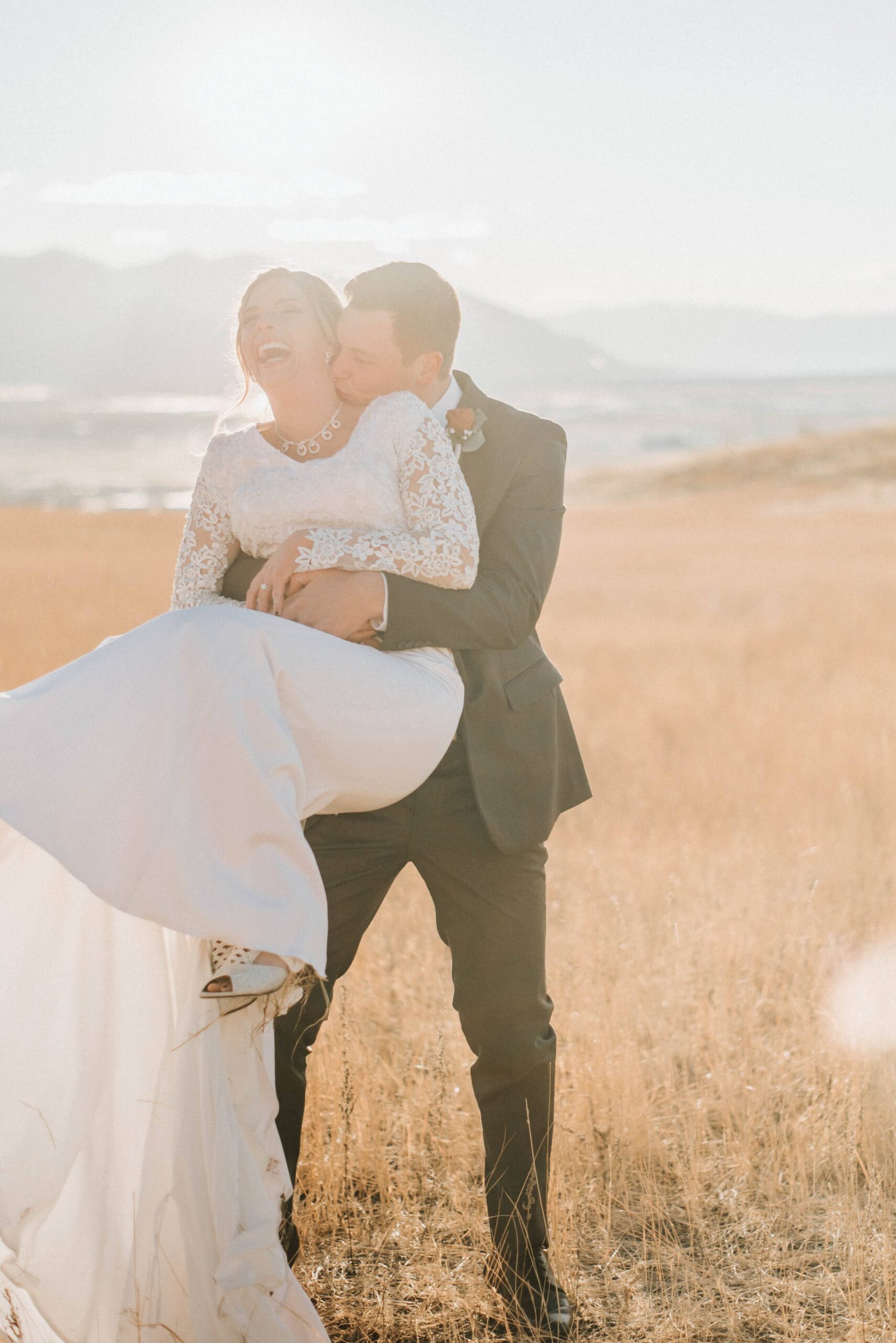 boy tickling girl, both laughing.