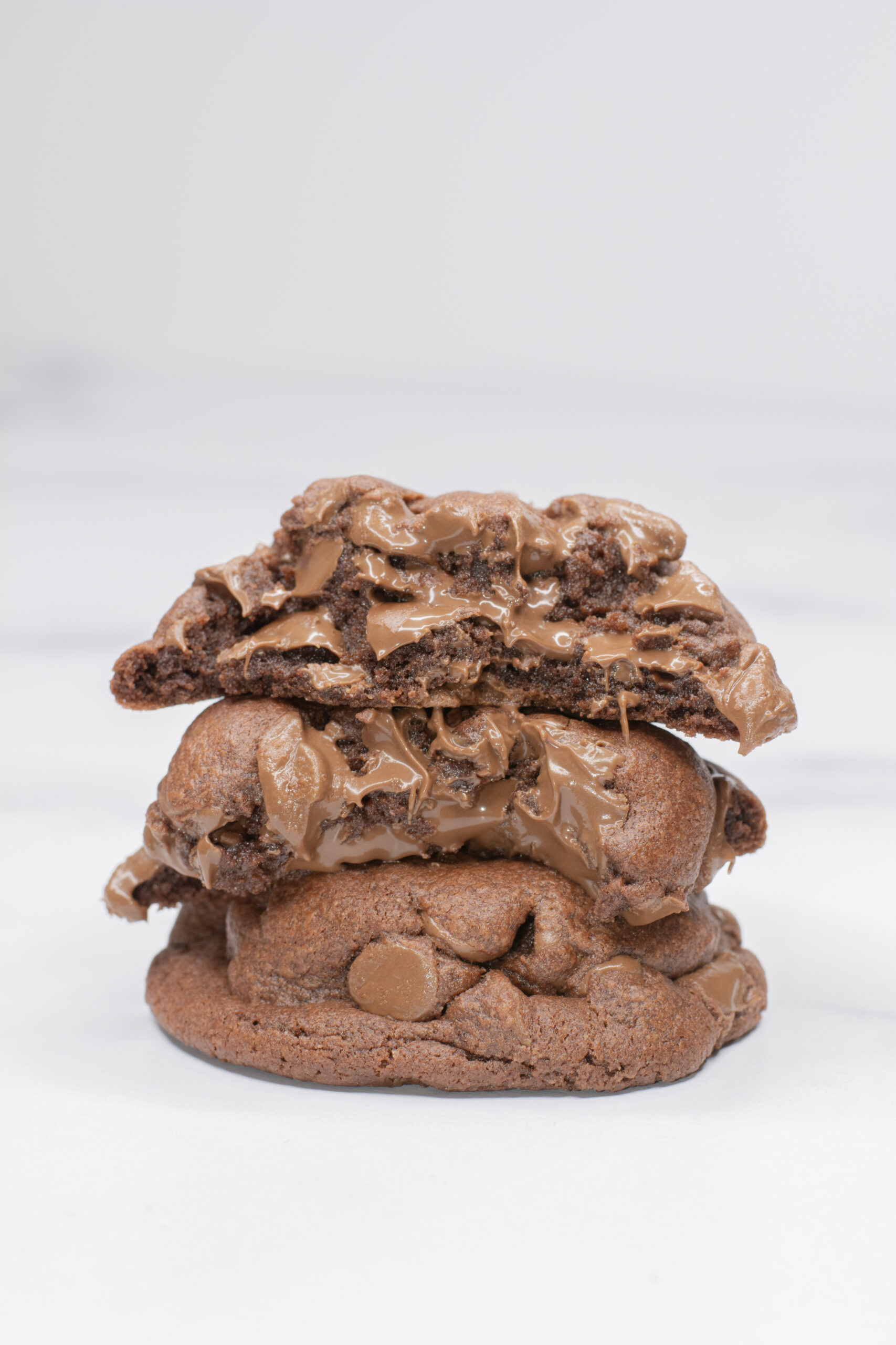 Chocolate Pudding Cookies stacked on top of each other.