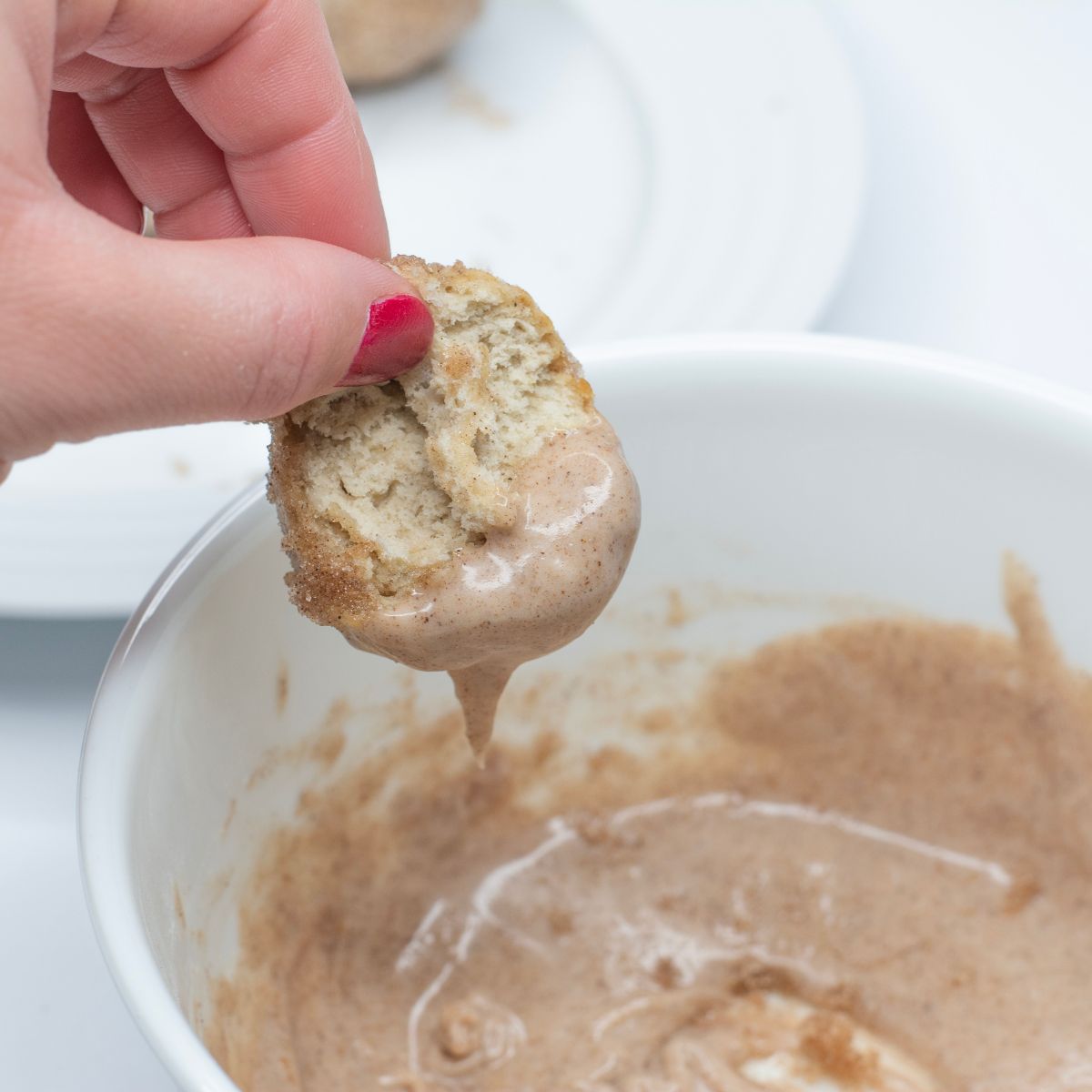 Banana Cinnamon Donut Holes dipped in cinnamon sugar glaze.