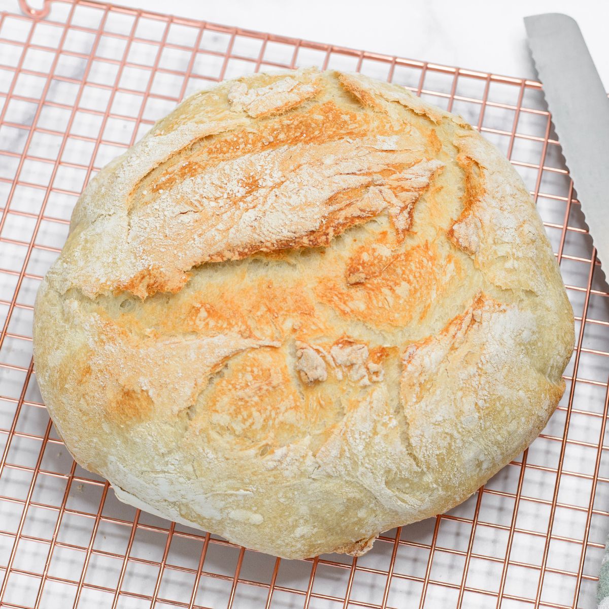 Dutch Oven Bread on a wire cooling rack. 