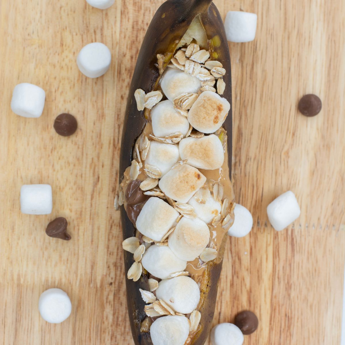 Banana Boat with chocolate chips and marshmallows in a peanut butter banana boat.
