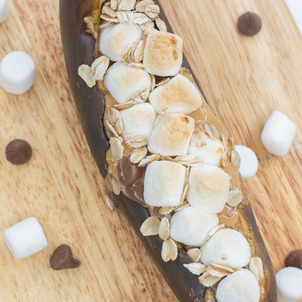 Toasted marshmallows, chocolate chips, and peanut butter melted in a banana split in half.