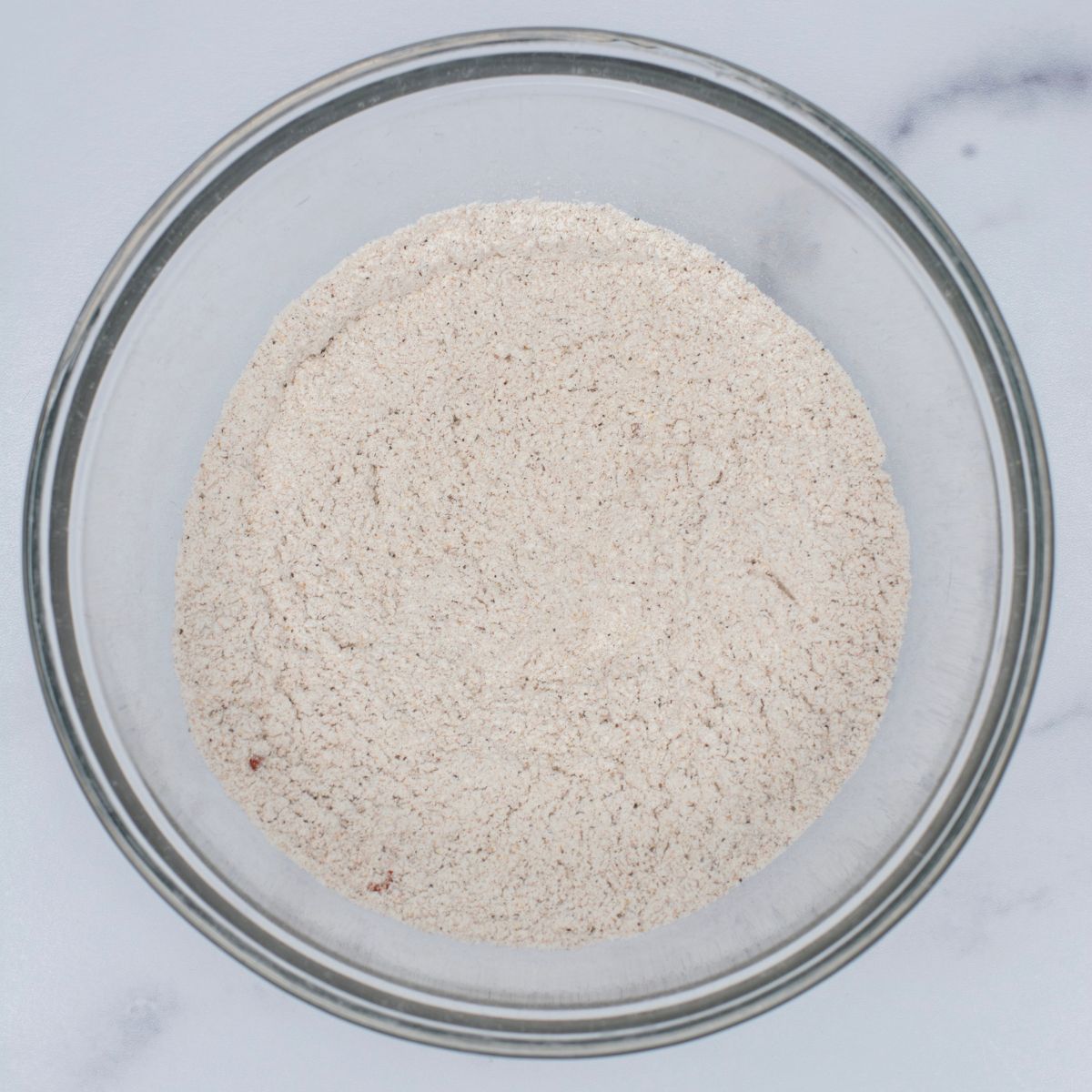 Flour and spices in a bowl.