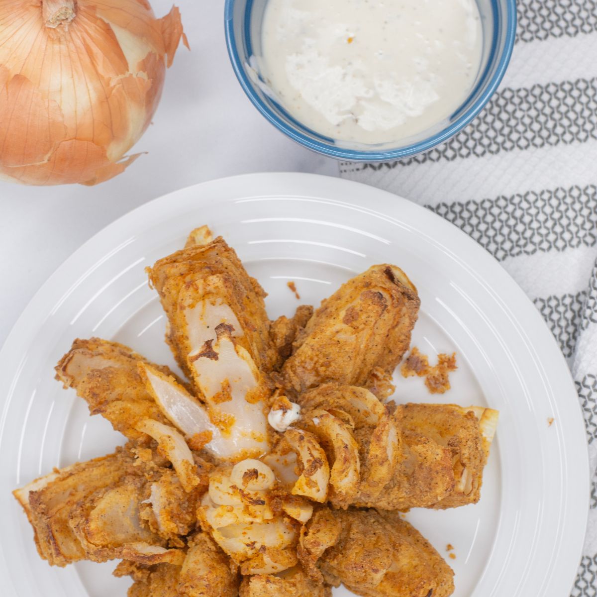 Air Fried Bloomin' Onion on a plate with ranch