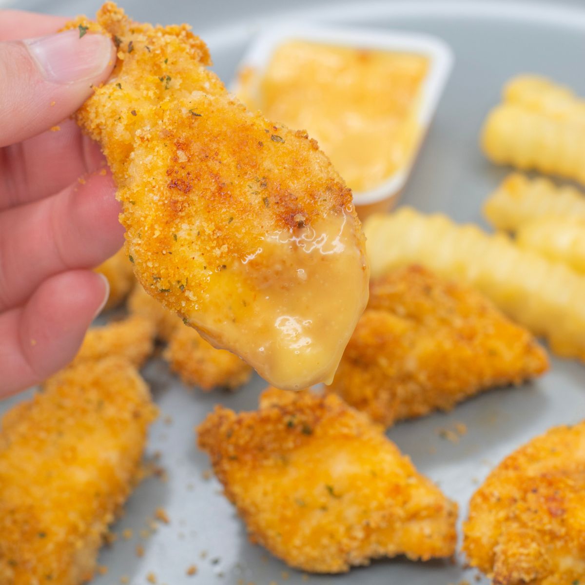 homemade chicken nuggets dipped in a homemade copycat chick-fil-a sauce