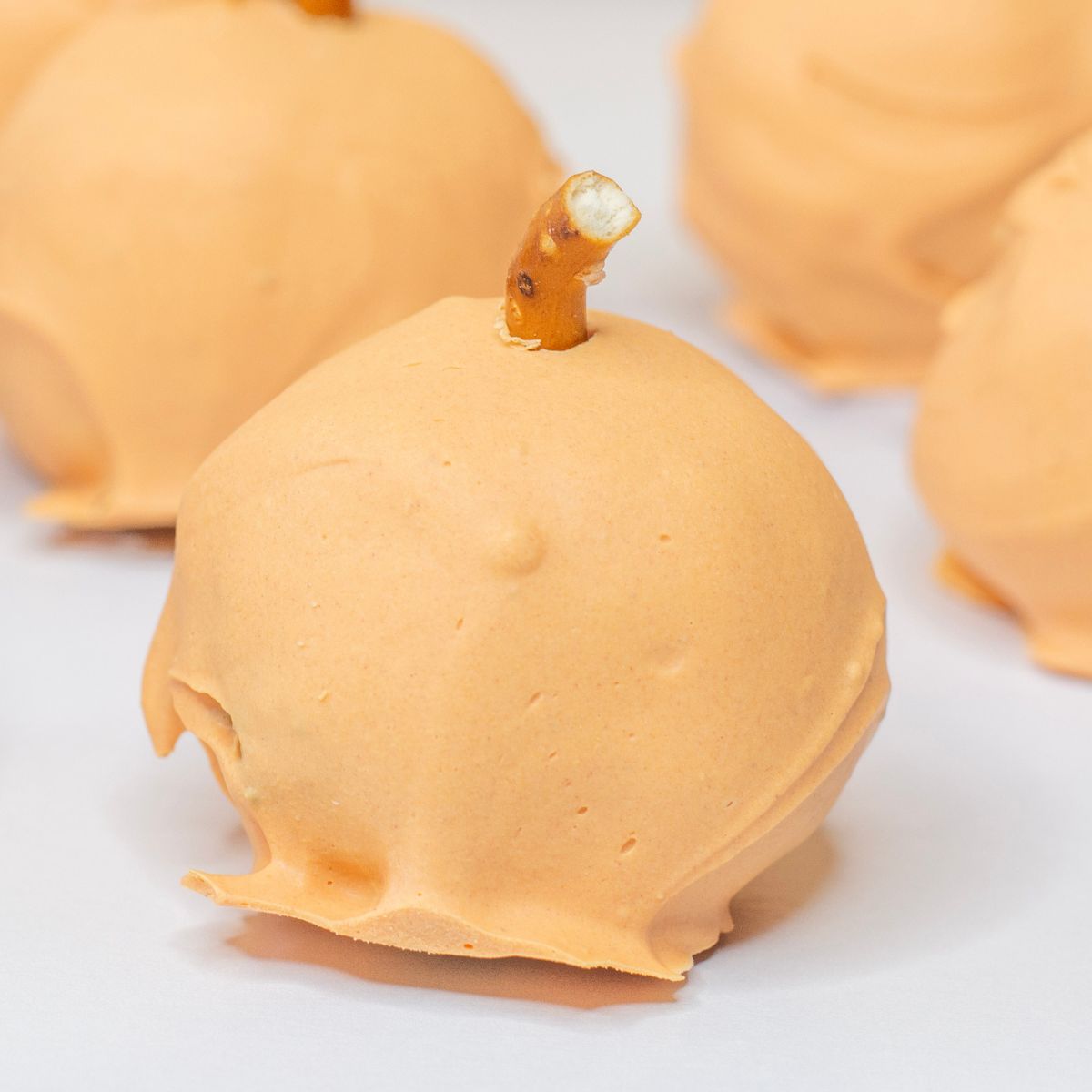 orange decorated Oreo balls to look like pumpkins