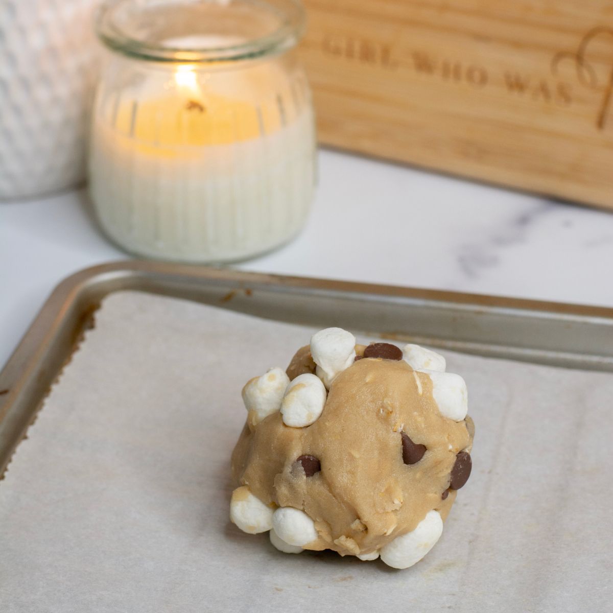 cookie dough on a baking sheet for one large cookie
