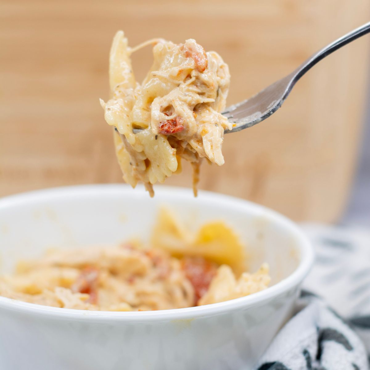 A fork holding marry me chicken pasta