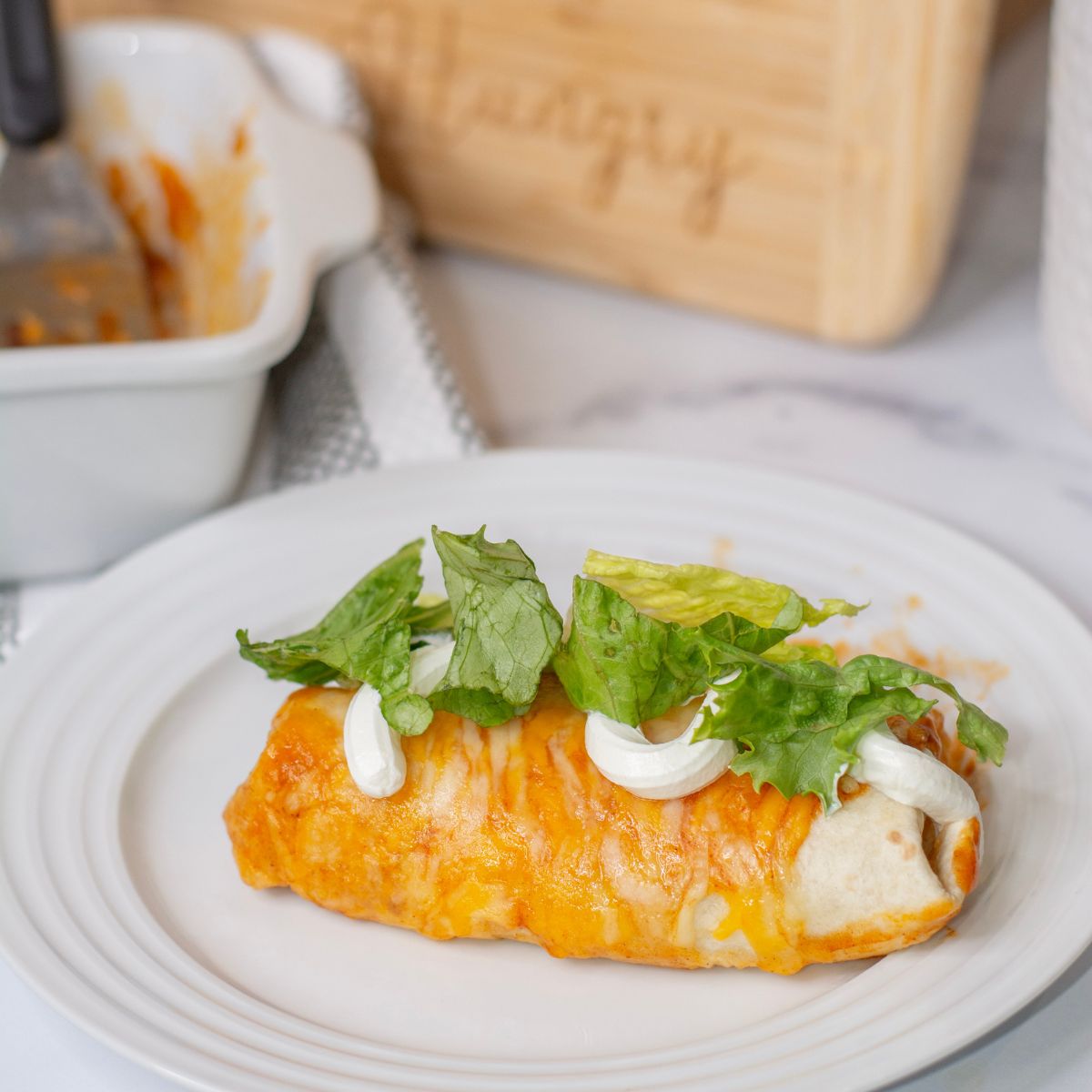 Easy Enchilada recipe with sour cream and toppings.