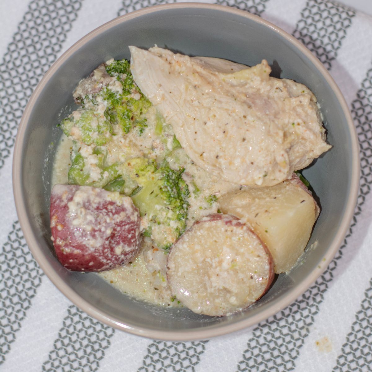 chicken and potato slow cooker dinner served in a bowl on the table