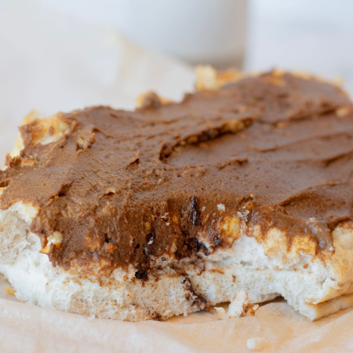 Cloud bread close up visual with peanut butter chocolate frosting spread on top.