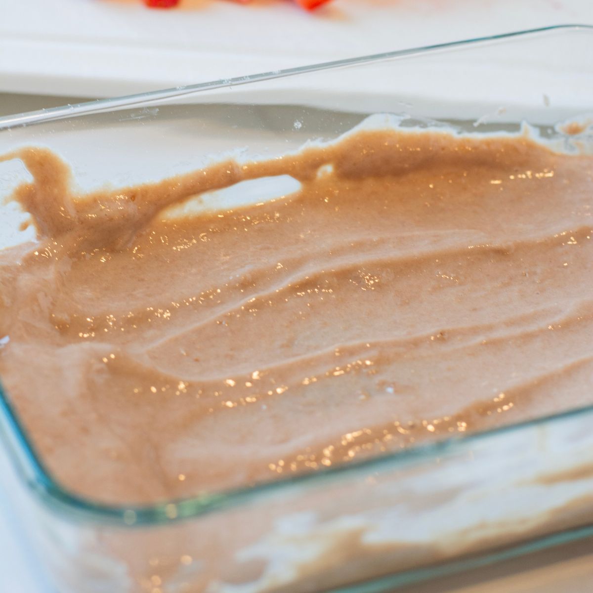 Protein powder and yogurt mixed together in a container.
