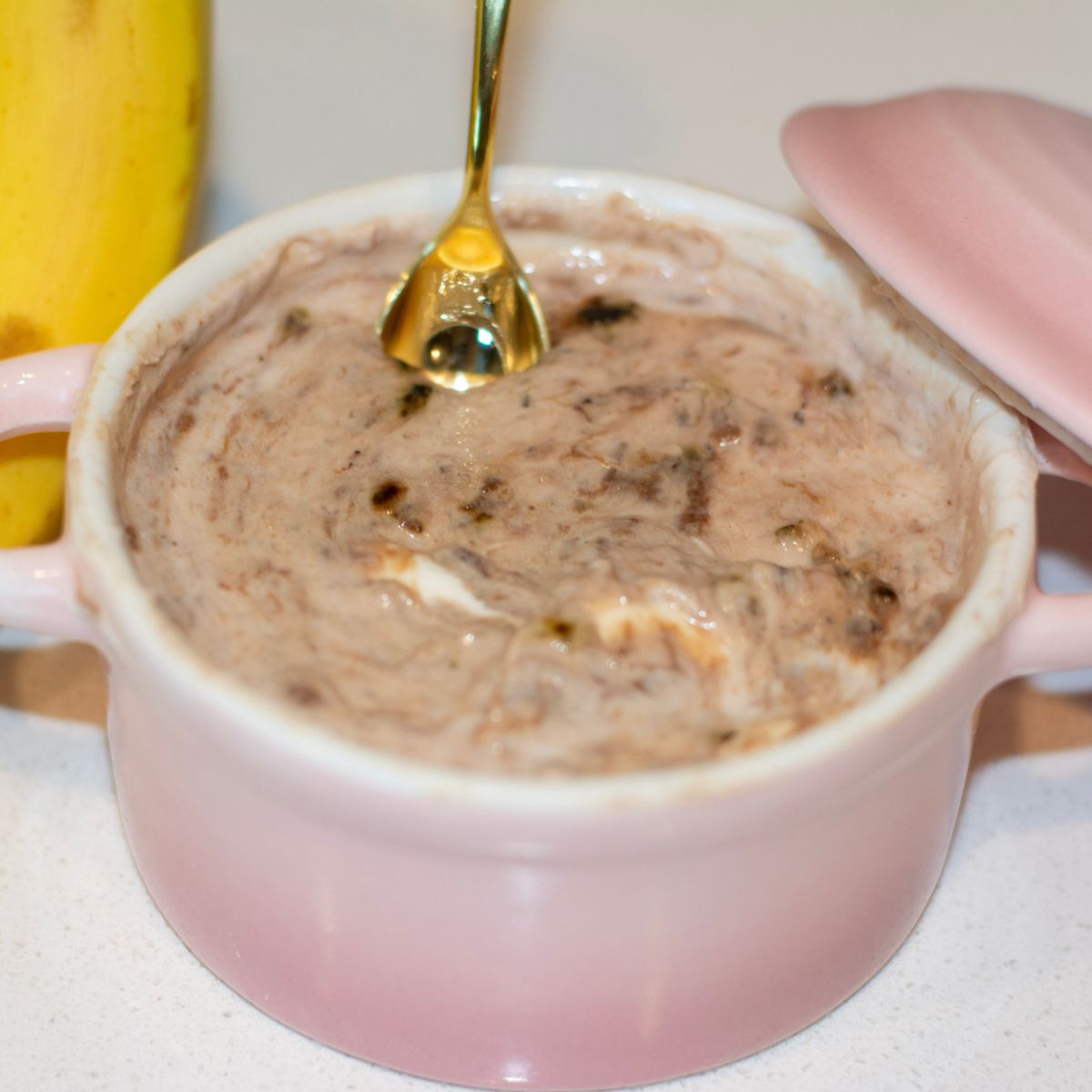 Small ramekin full of chocolate banana yogurt ice cream