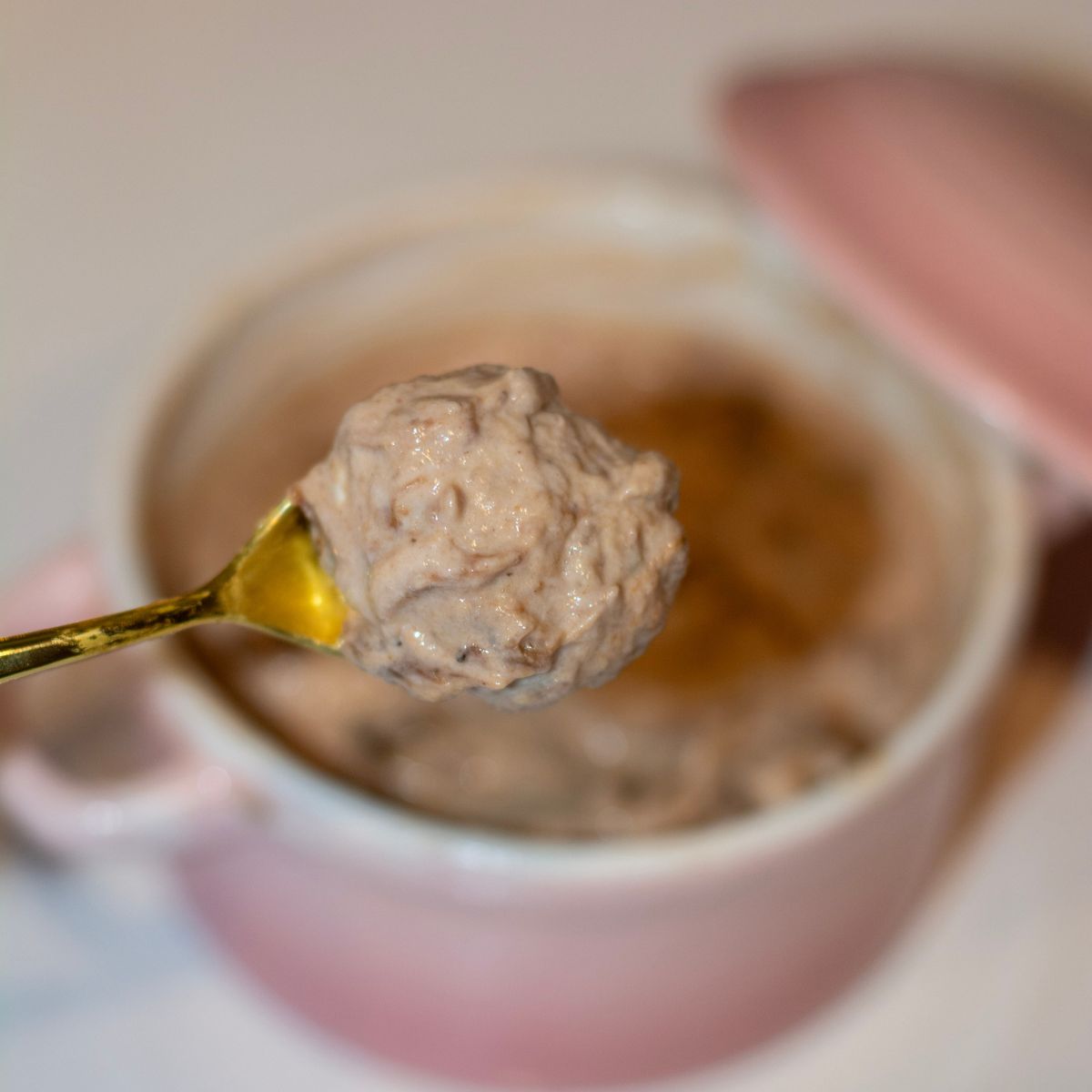 A spoon full of chocolate banana nice cream.