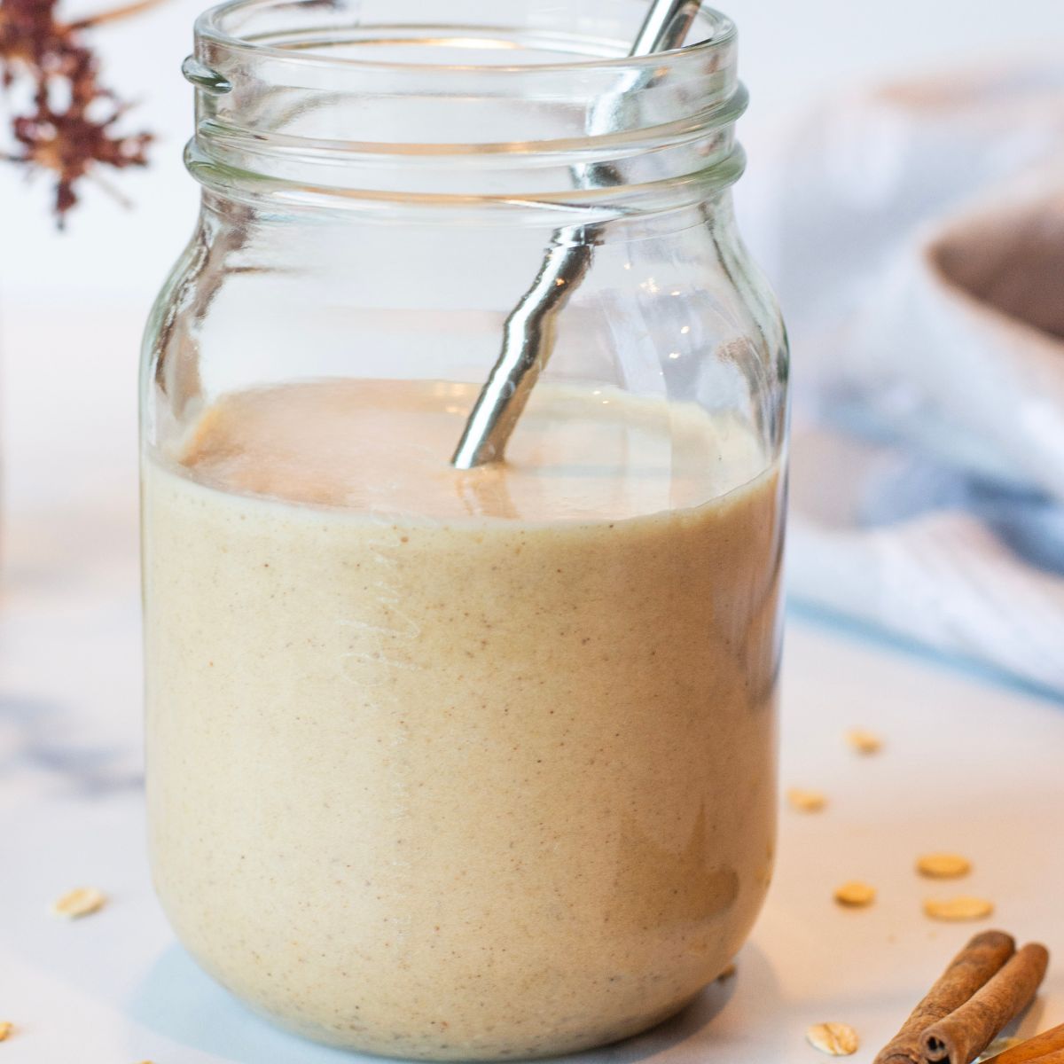 Mason jar filled with a thick and creamy smoothie consistency. 