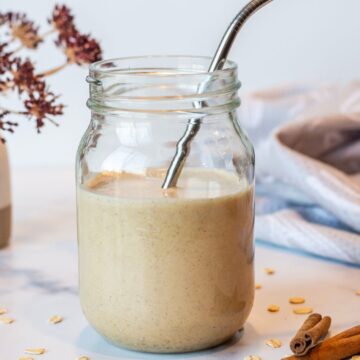 Cookie Dough Date Smoothie in a mason jar with a metal straw