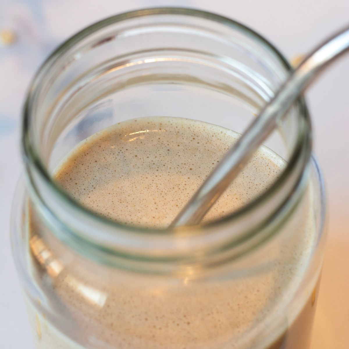 Close up image of the cookie dough date smoothie and the texture looks thick and creamy.