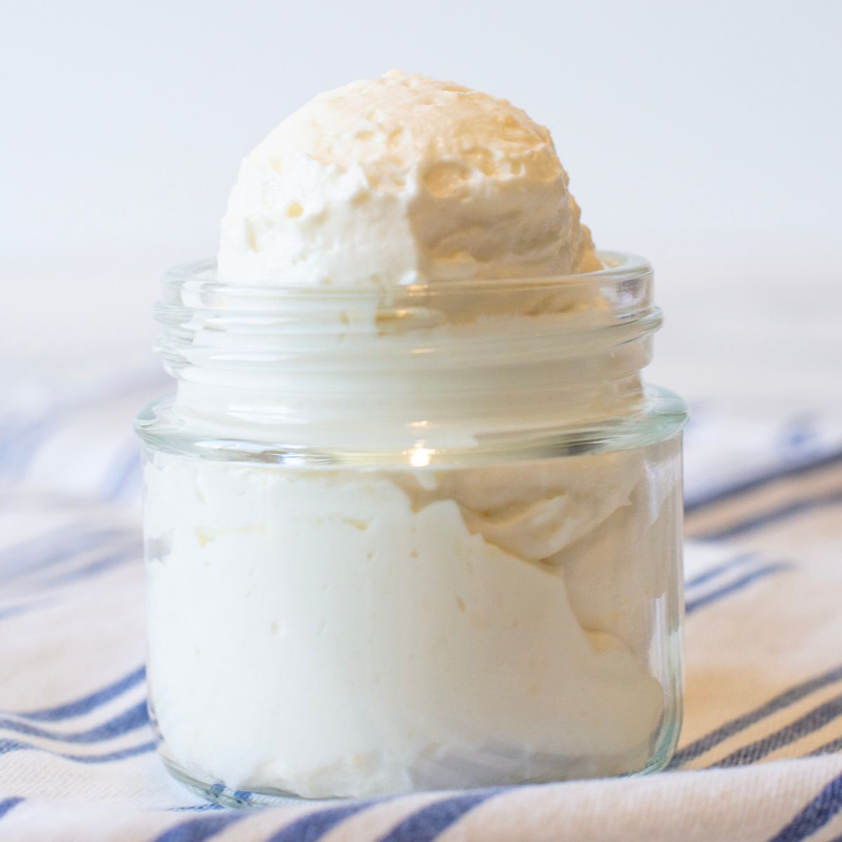 Fluffy protein yogurt in a glass container. 